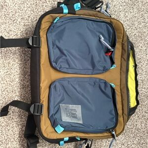 Topo Designs Men’s Blue Pocket Sling Pack with Brown Body and Turquoise Accents